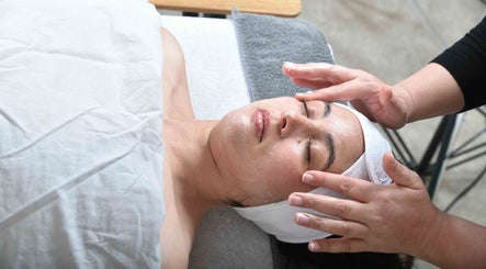 Relaxing facial massage at Glow by Daisy, Crabtree, England, GB, enhancing skin tranquility and wellness.