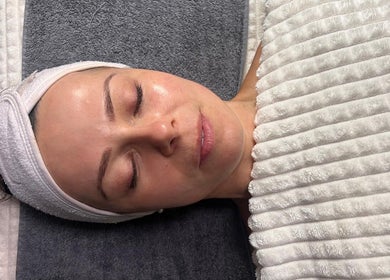 Relaxing facial at Glow by Daisy, Crabtree, England, GB. Woman enjoying soothing spa treatment.