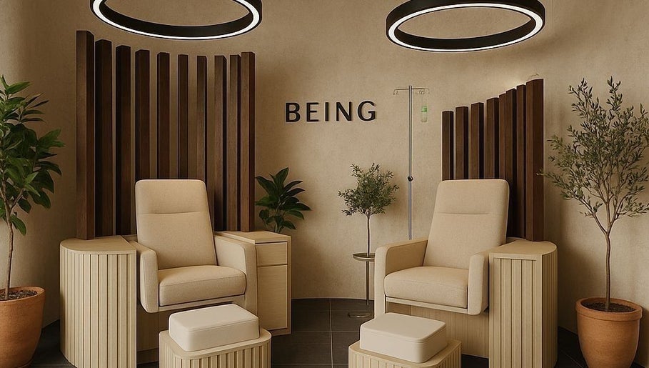 Elegant relaxation chairs at Being | Bryanston in Sandton, Gauteng, ZA with modern decor and lush greenery.