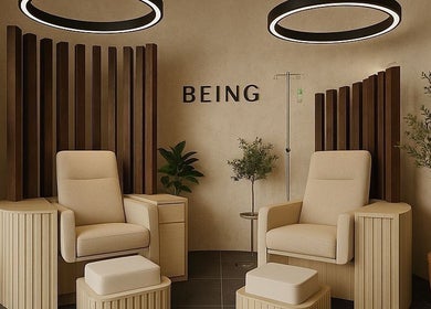 Elegant relaxation chairs at Being | Bryanston in Sandton, Gauteng, ZA with modern decor and lush greenery.