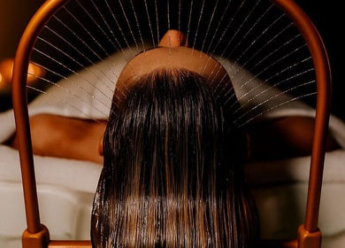 Relaxing head massage with water at Being | Fourways, Sandton, Gauteng, ZA, enhancing wellness and tranquility.