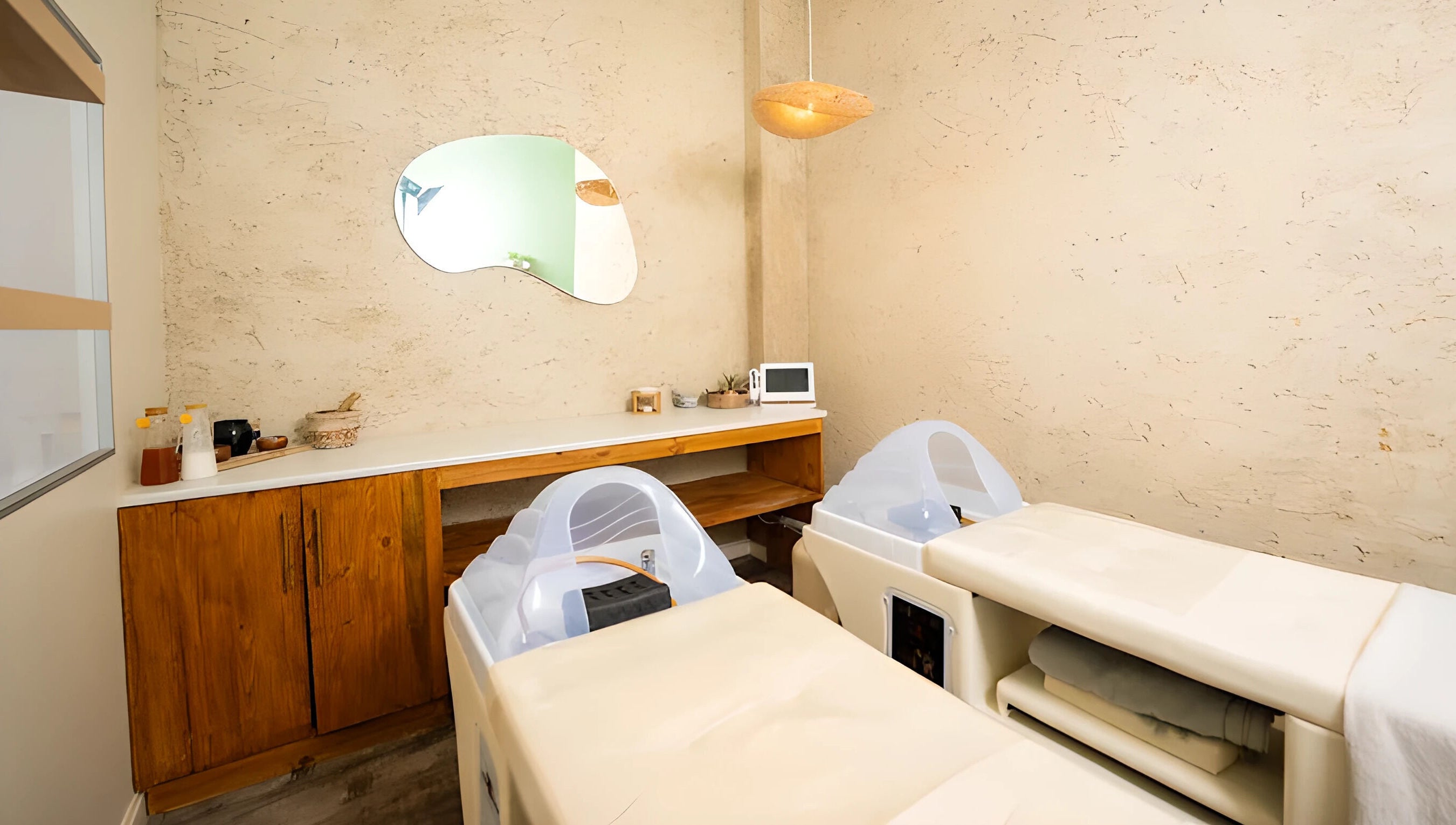 Tranquil spa room at being | Morningside in Sandton, Gauteng, ZA featuring relaxing massage tables.