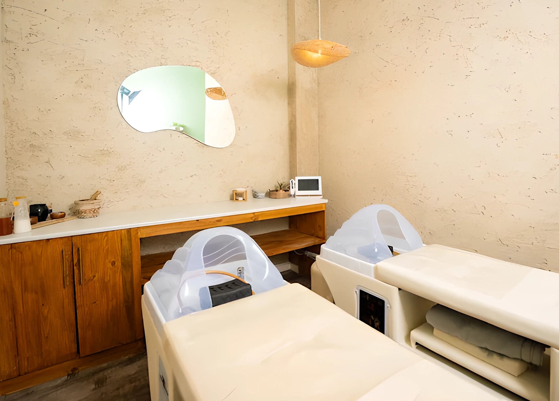 Tranquil spa room at being | Morningside in Sandton, Gauteng, ZA featuring relaxing massage tables.