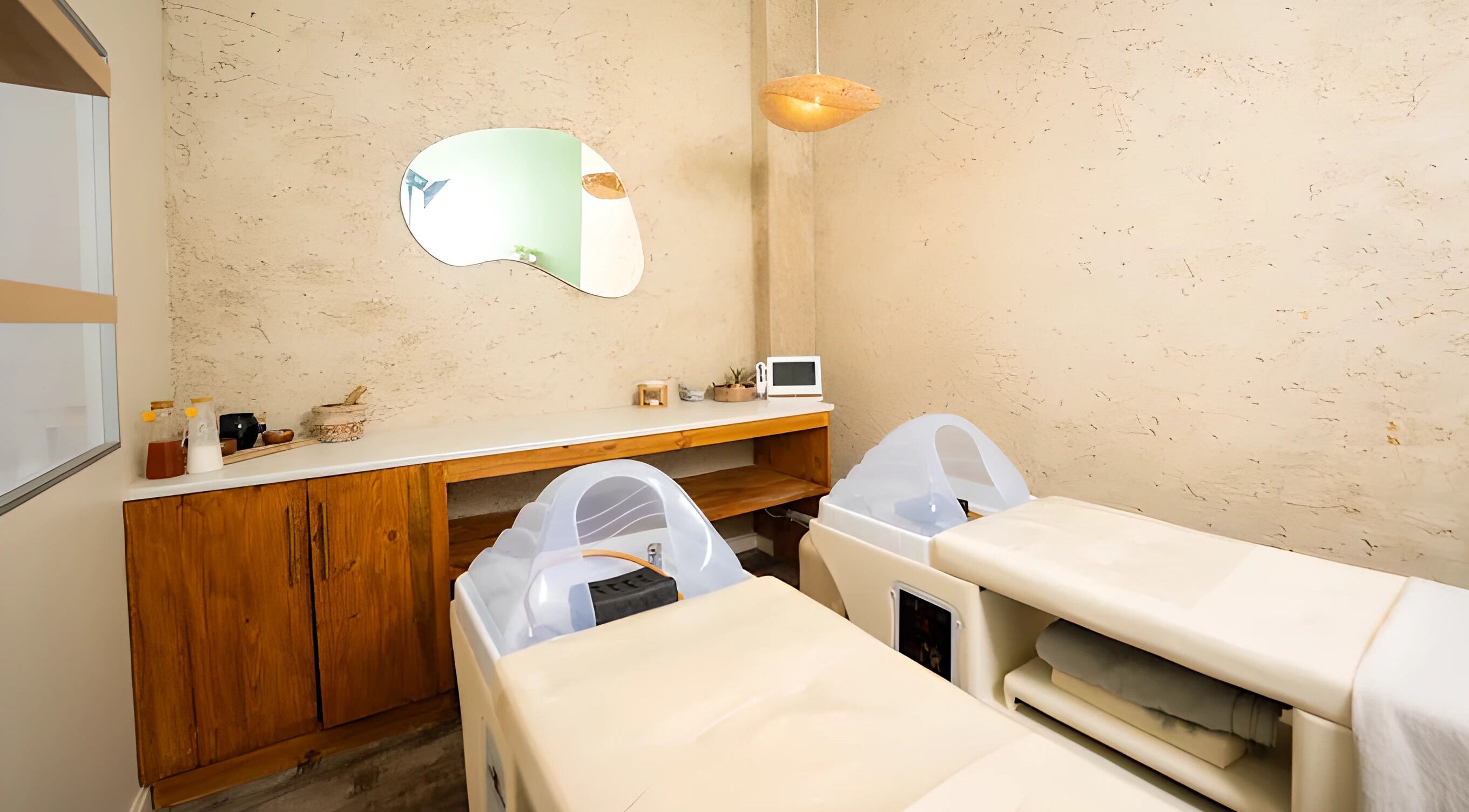 Tranquil spa room at being | Morningside in Sandton, Gauteng, ZA featuring relaxing massage tables.