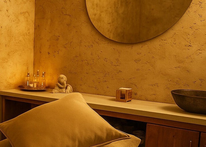 Warm-toned serene treatment room at being | Morningside in Sandton, Gauteng, ZA, with soft lighting and decor.