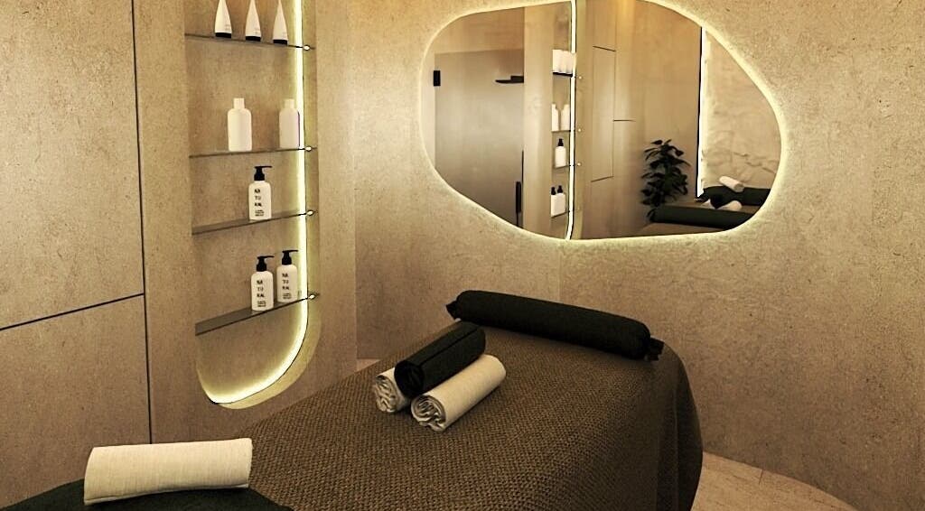Calming spa room at Being | Fourways, Sandton, Gauteng, ZA, with massage bed and ambient lighting.