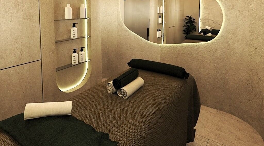 Tranquil massage room at being | Bryanston in Sandton, Gauteng, ZA with modern decor and soft lighting.