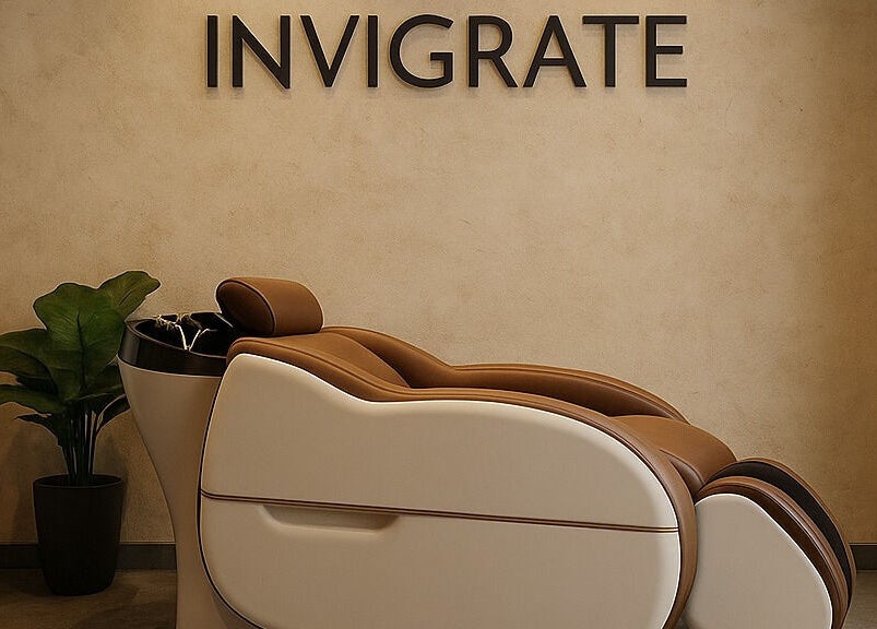 Elegant massage chair in serene room at being | Bryanston, Sandton, Gauteng, ZA with calming plant decor.