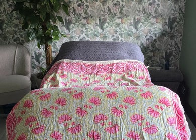 Tranquil therapy room at Lauren Louise Wellness, Biggleswade, England, GB with cozy chair and floral decor.
