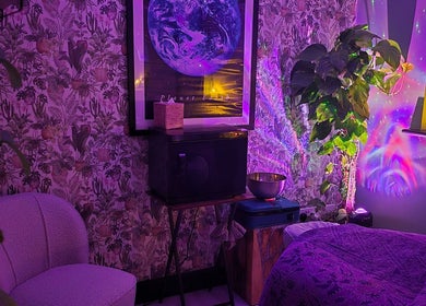 Lauren Louise Wellness cozy room with purple lighting in Biggleswade, England, GB. Features lush decor and wall art.