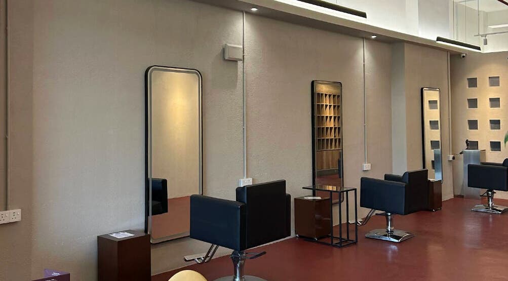Modern salon interior at Hairkunst 13 in Shah Alam, Selangor, MY with mirrors and styling chairs.
