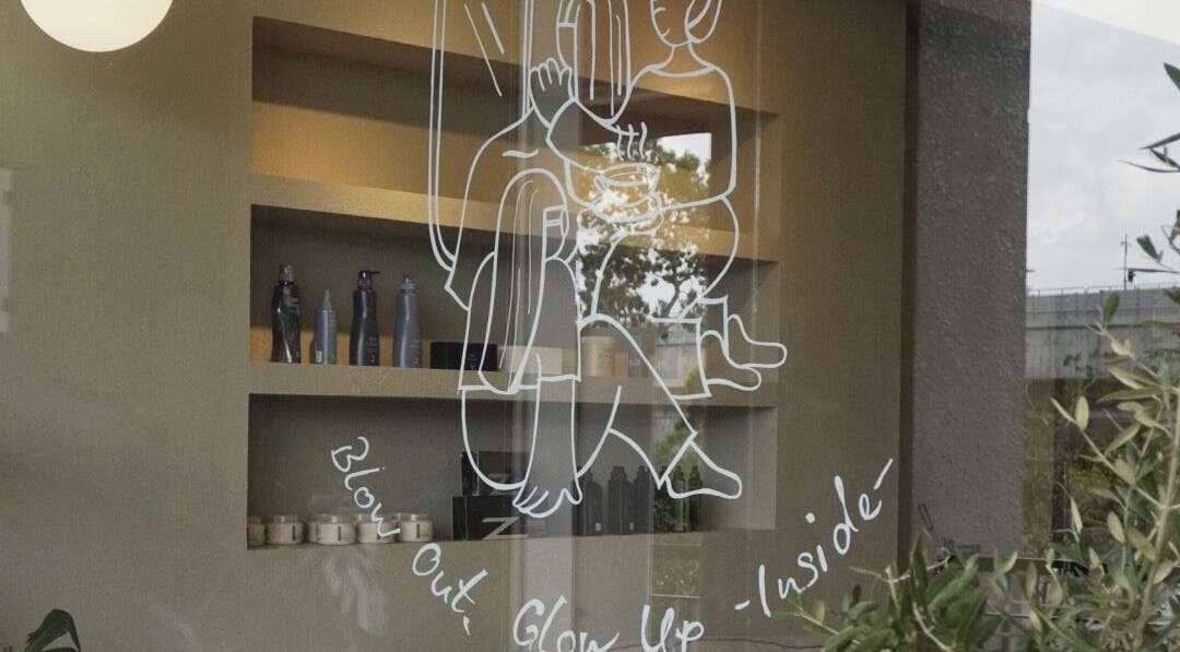 Creative window art at Hairkunst 13 in Shah Alam, Selangor, MY showcasing beauty elements indoors.