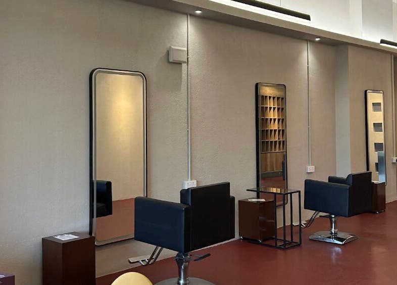 Modern salon chairs and mirrors inside Hairkunst 13, Shah Alam, Selangor, MY.