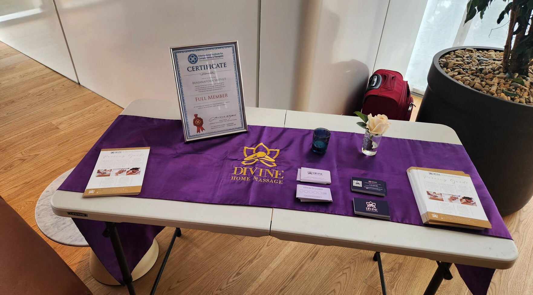 Divine Home Massage welcome table in City of Sydney, AU displaying certificates and brochures.