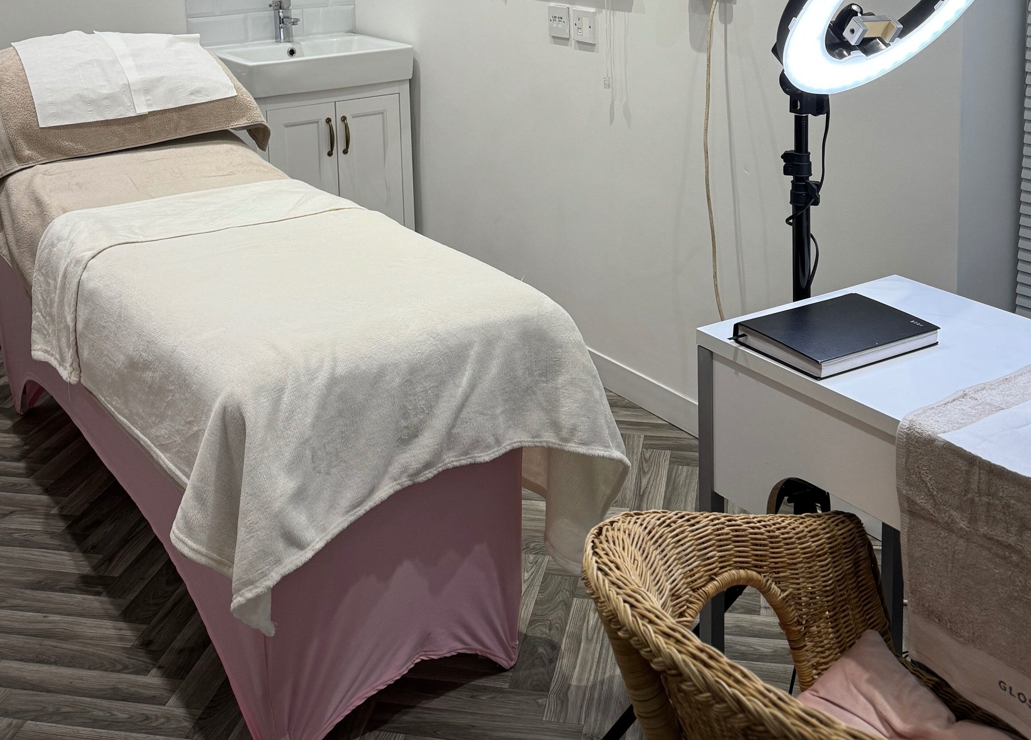 Relaxing treatment room at Blossom Salon, Shrewsbury, England, GB. Features a cozy massage table and modern decor.