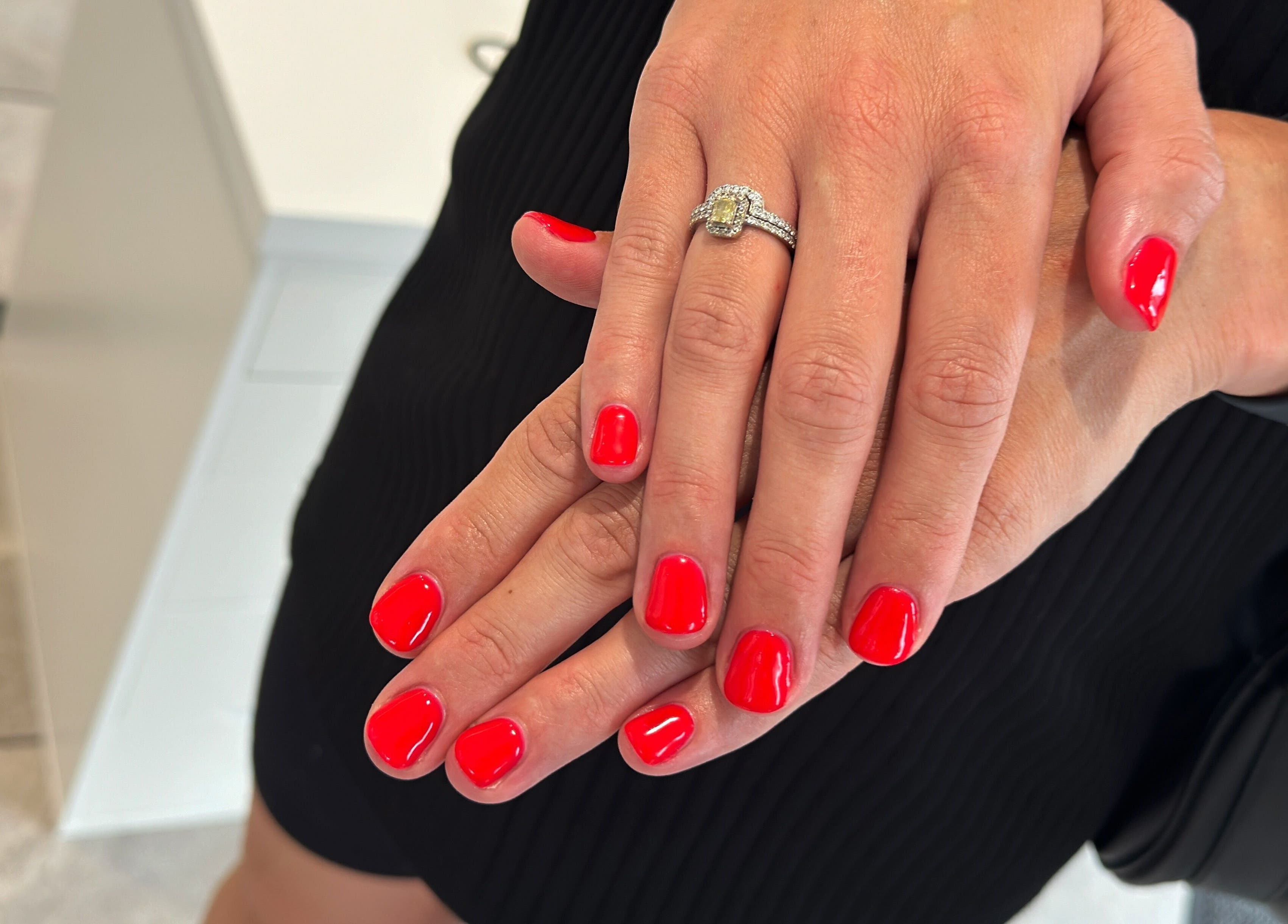 Fresh red manicure at Blossom Salon, Shrewsbury, England, GB, showcasing elegant nail artistry.