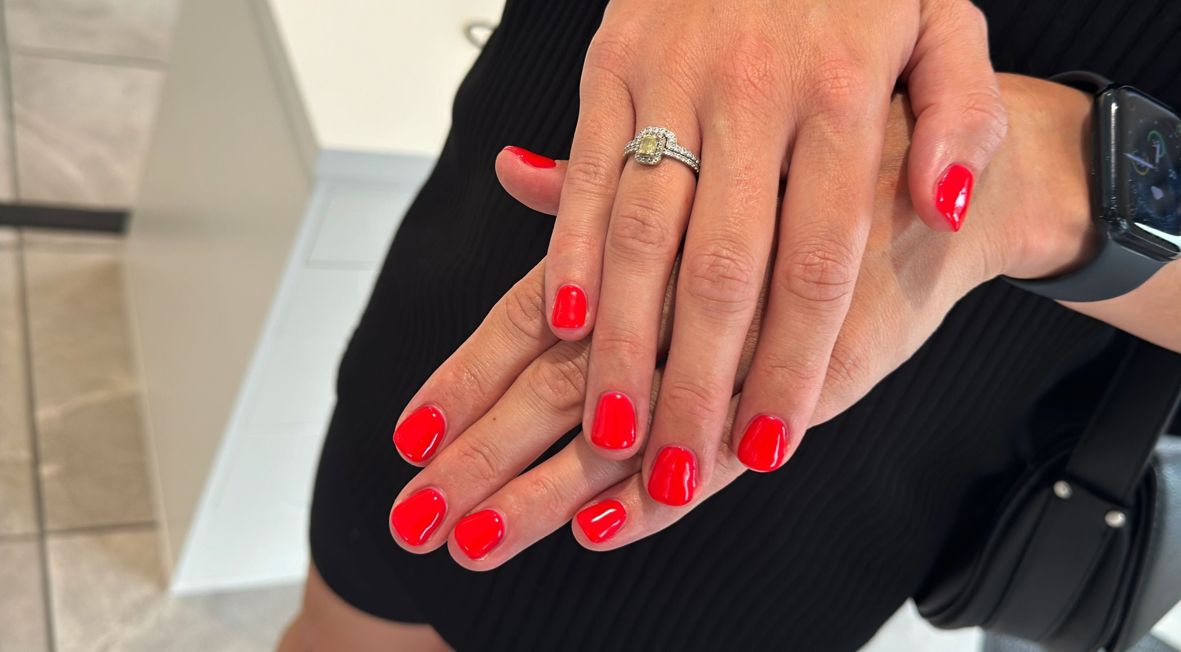 Fresh red manicure at Blossom Salon, Shrewsbury, England, GB, showcasing elegant nail artistry.