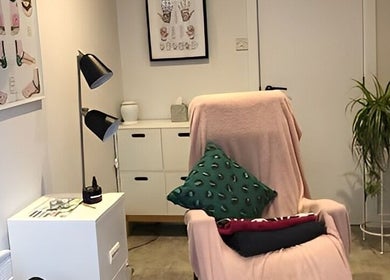 Relaxing therapy room at Emma Bateman Reflexology, York, England, GB with a cozy chair and calming decor.