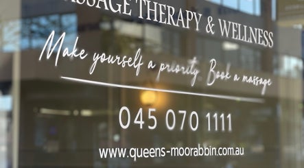 Queens Massage Therapy & Wellness window with contact info, Melbourne, Victoria, AU.