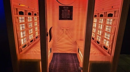 Relaxing sauna room at The Firm Elegance in Beauty, Cape Town, Western Cape, ZA with warm lighting and wooden interiors.