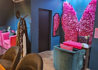 Vibrant interior at The Firm Elegance in Beauty, Cape Town, Western Cape, ZA with pink wings wall art.