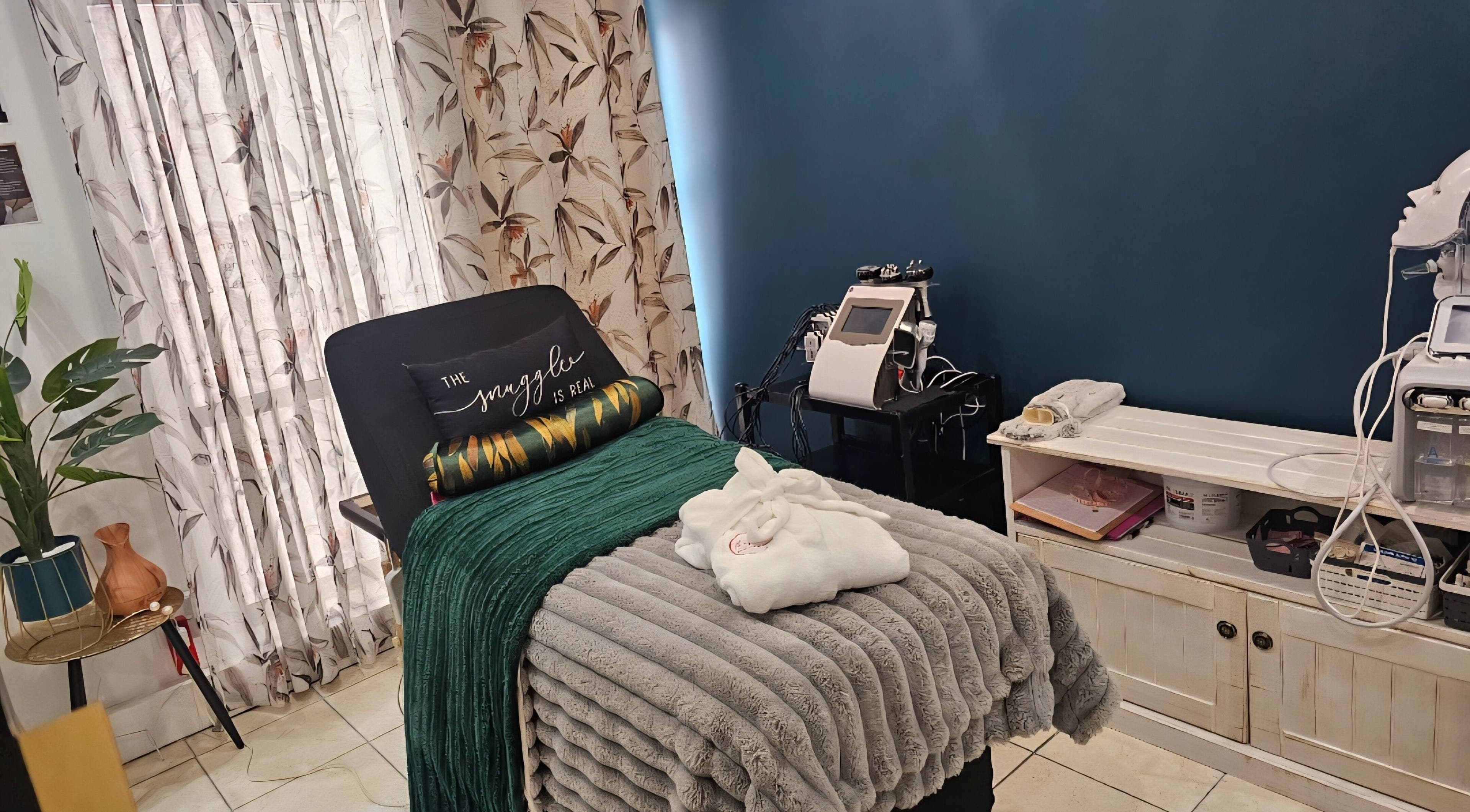 Relaxing treatment room at The Firm Elegance in Beauty, Cape Town, Western Cape, ZA with plush decor and wellness equipment.