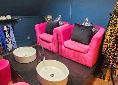 Stylish pink chairs and foot basins at The Firm Elegance in Beauty, Cape Town, Western Cape, ZA.