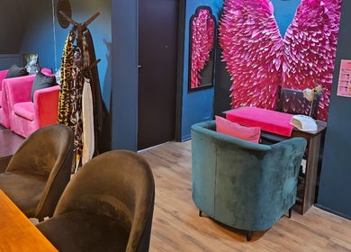 Stylish lounge with pink chairs and decor at The Firm Elegance in Beauty, Cape Town, Western Cape, ZA.