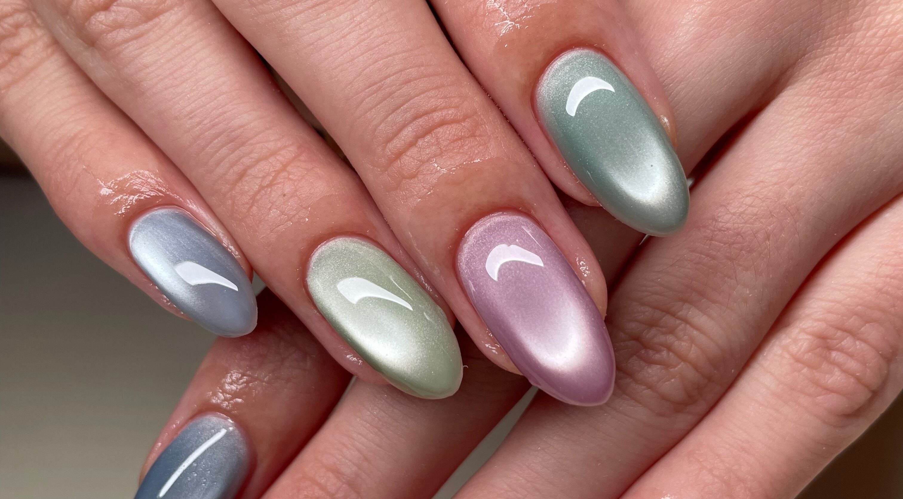 Stylish metallic nails at Montanna Here 2 Glow, London, Ontario, CA, showcasing vibrant nail artistry.