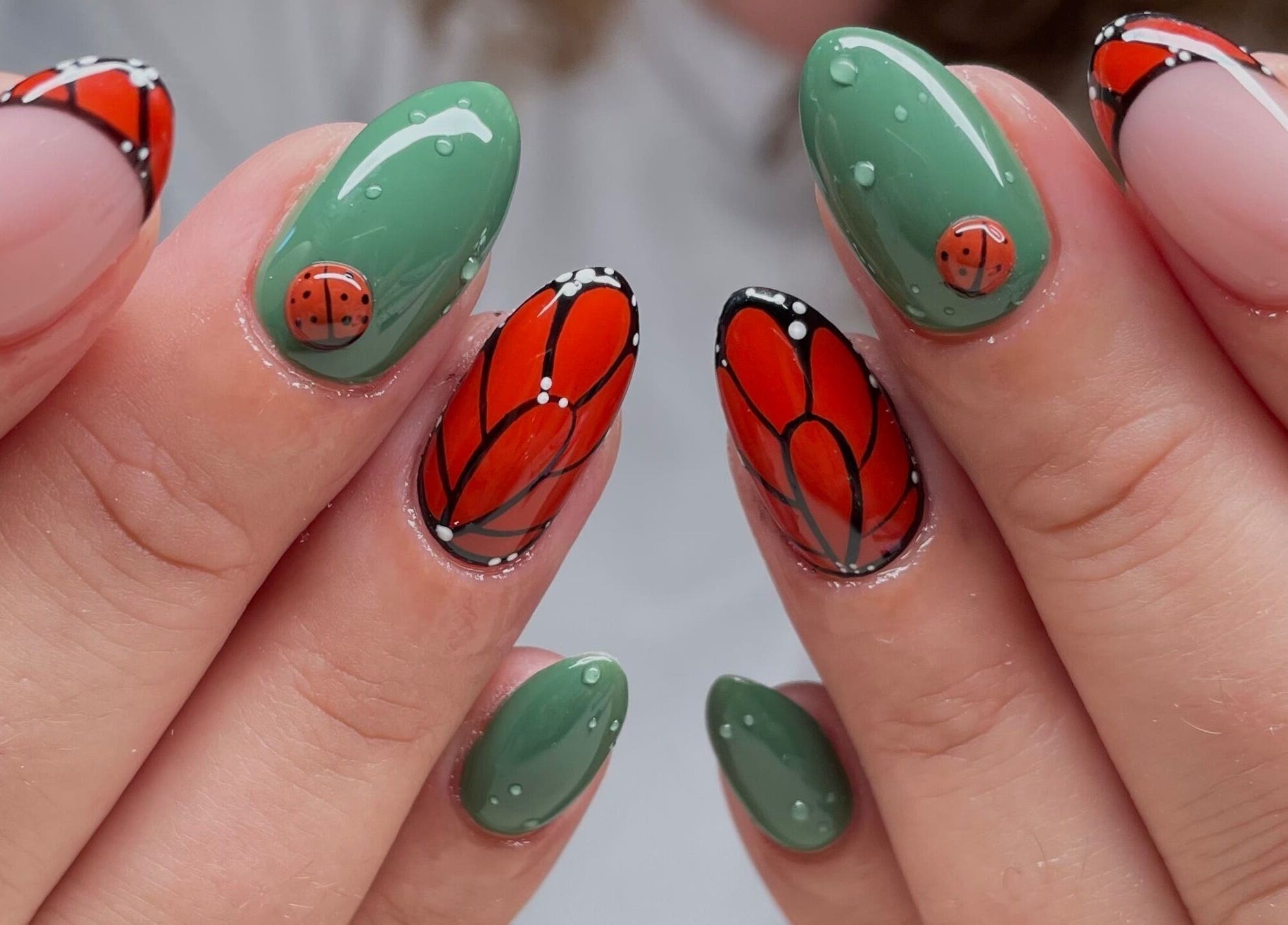 Stunning butterfly and ladybug nail art by Montanna Here 2 Glow in London, Ontario, CA.