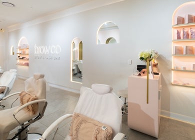 Interior of Browco Brow & Lash Bar - Warringah Mall in Brookvale, New South Wales, AU. Modern decor and cozy seating.