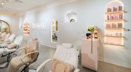 Interior of Browco Brow & Lash Bar - Warringah Mall in Brookvale, New South Wales, AU. Modern decor and cozy seating.