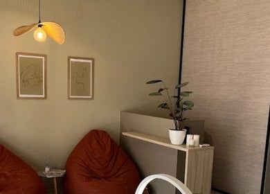 Relaxing lounge area at Lashes by Nadine, Wellington, Western Cape, ZA with soft lighting and modern decor.