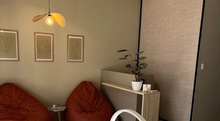 Relaxing lounge area at Lashes by Nadine, Wellington, Western Cape, ZA with soft lighting and modern decor.