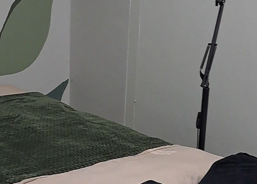 Treatment bed with green blanket at Nadine at Dawn Wellness and Beauty, Wellington, Western Cape, ZA.