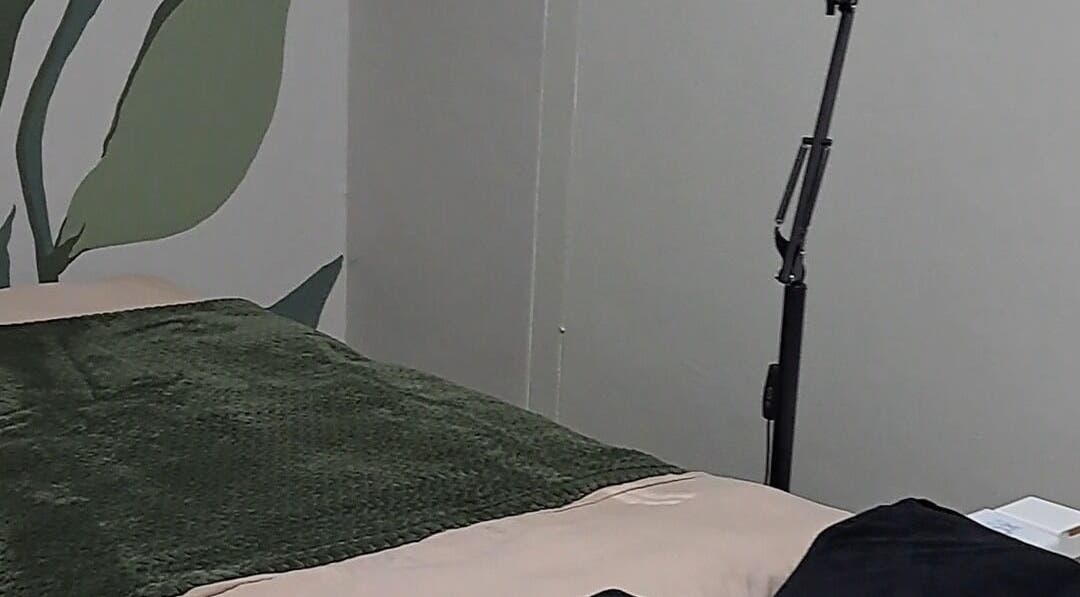 Treatment bed with green blanket at Nadine at Dawn Wellness and Beauty, Wellington, Western Cape, ZA.