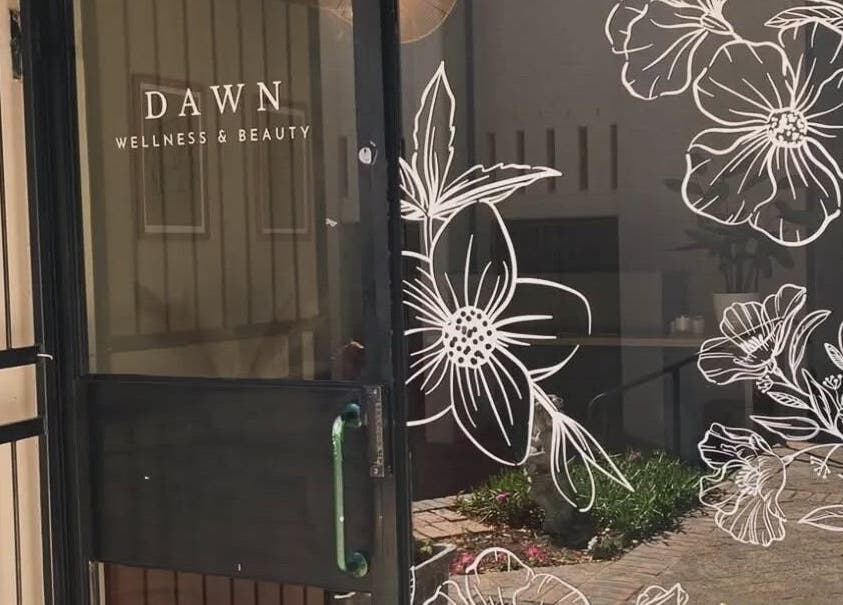 Entrance of Nadine at Dawn Wellness and Beauty, Wellington, Western Cape, ZA with floral glass art.