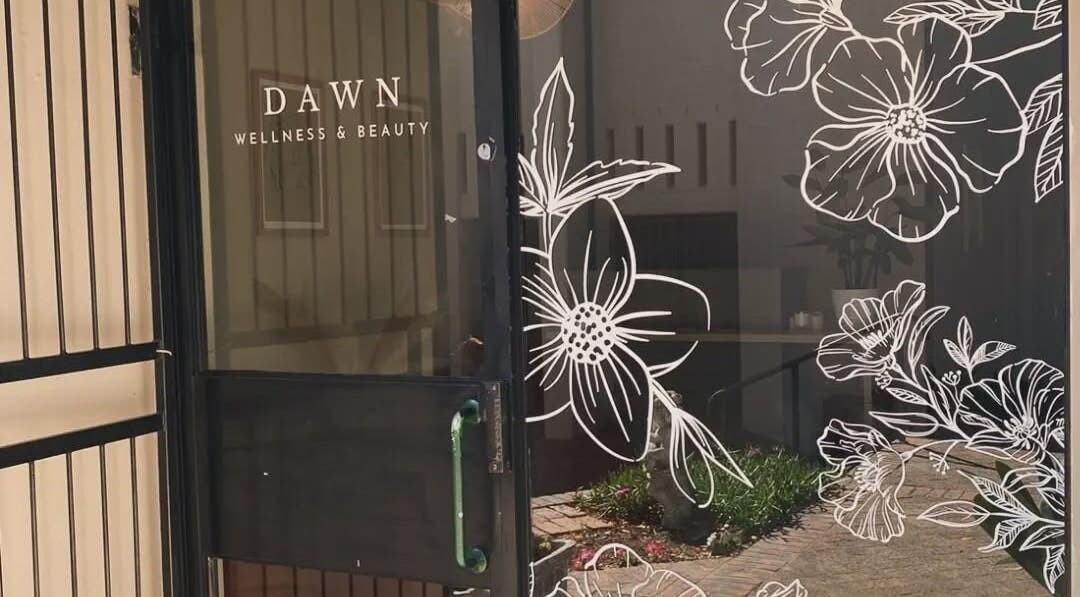 Entrance of Nadine at Dawn Wellness and Beauty, Wellington, Western Cape, ZA with floral glass art.