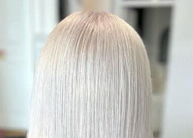 Sleek platinum blonde hair styled at Hair By Amy, Oswestry, England, GB.