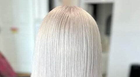 Sleek platinum blonde hair styled at Hair By Amy, Oswestry, England, GB.
