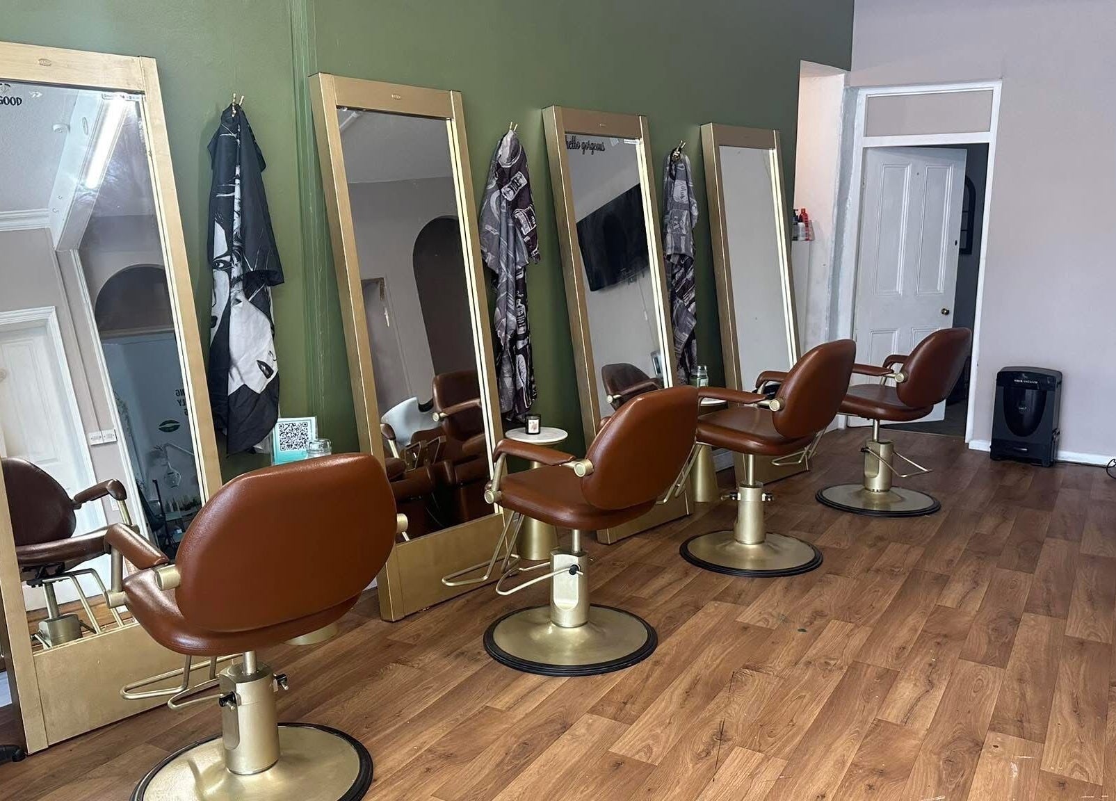 Stylish salon chairs and mirrors at Hair By Amy in Oswestry, England, GB, offering a chic beauty experience.