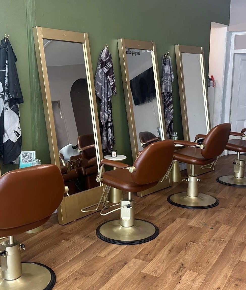 Stylish salon chairs and mirrors at Hair By Amy in Oswestry, England, GB, offering a chic beauty experience.