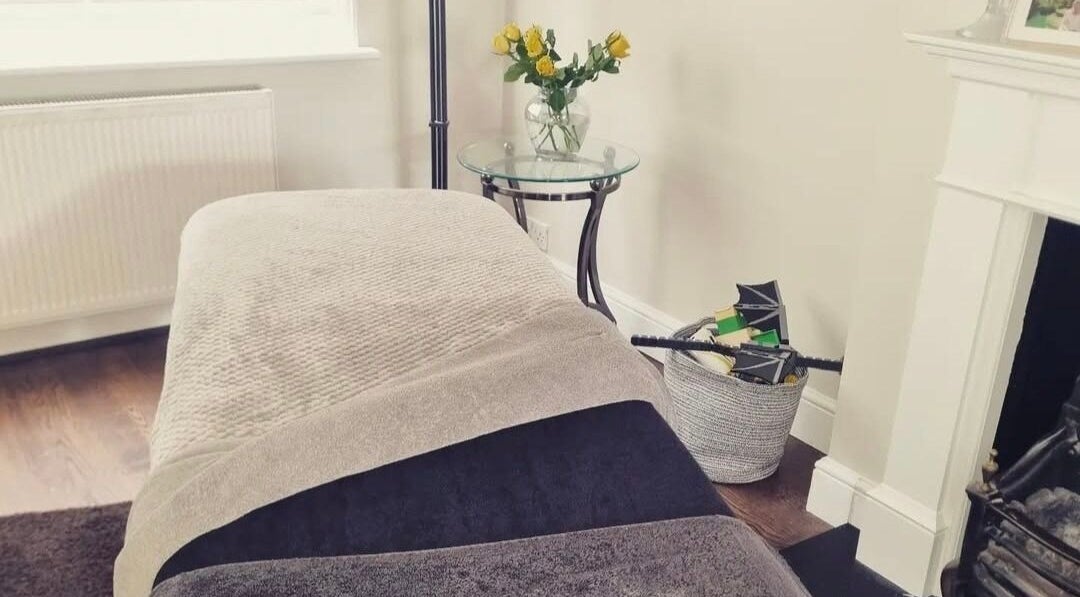 Relaxing treatment room at In Home Beauty by Sarah, Potters Bar, England, GB with cozy decor.