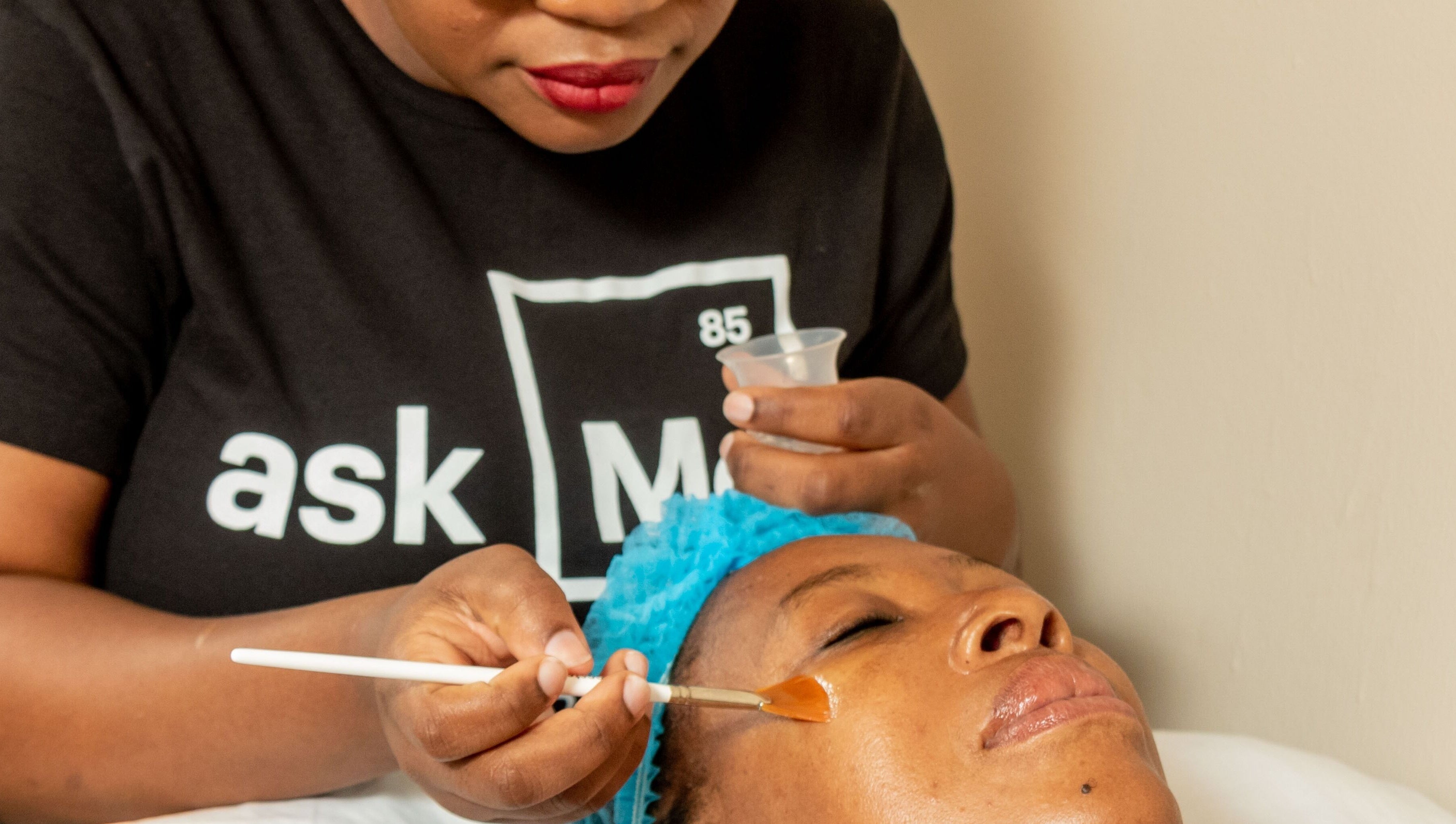 Facial treatment at First Aesthetics Bw in Gaborone, Gaborone City, BW with a beautician applying a facial mask.
