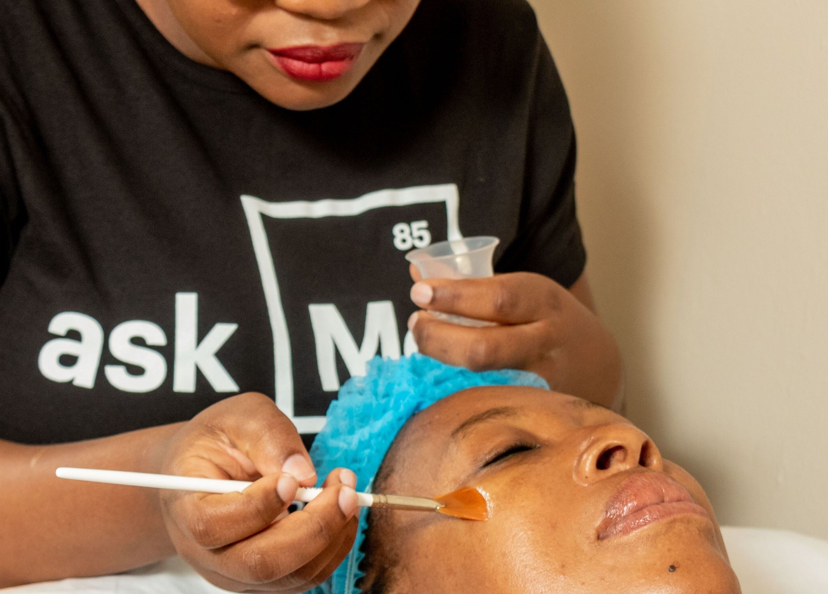 Facial treatment at First Aesthetics Bw in Gaborone, Gaborone City, BW with a beautician applying a facial mask.