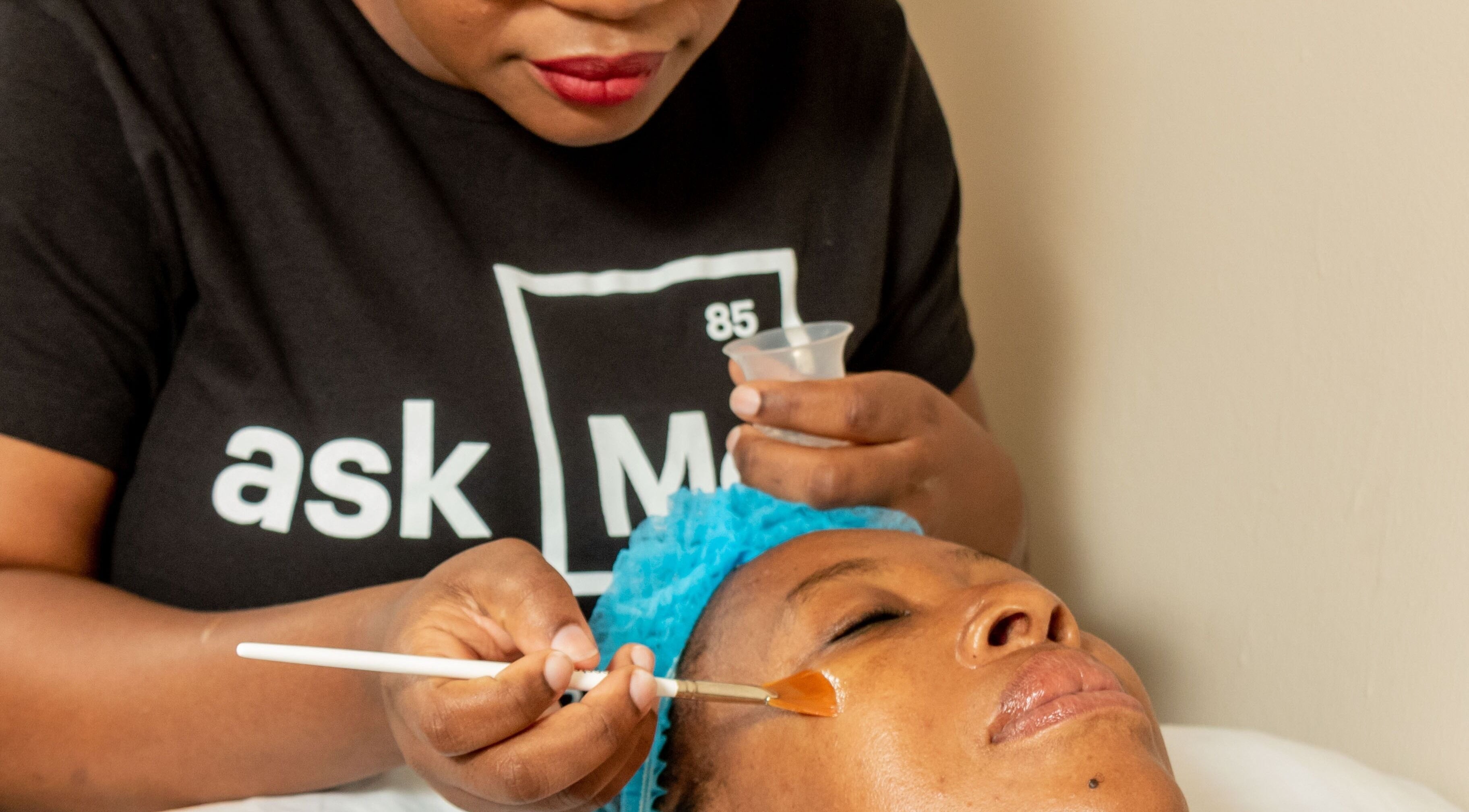 Facial treatment at First Aesthetics Bw in Gaborone, Gaborone City, BW with a beautician applying a facial mask.