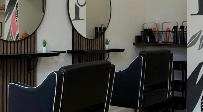 Modern salon interior at KGHD, Wellington, England, GB featuring stylish chairs and sleek decor.