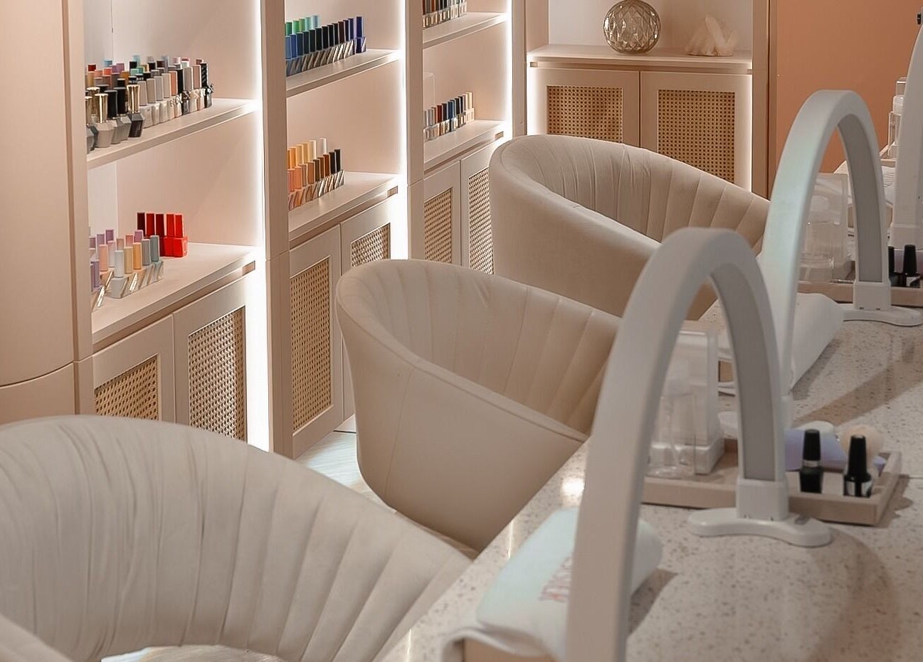 Stylish nail salon setup at Soulsister Nail, Hong Kong Island, Hong Kong Island, HK with plush chairs and polish display.