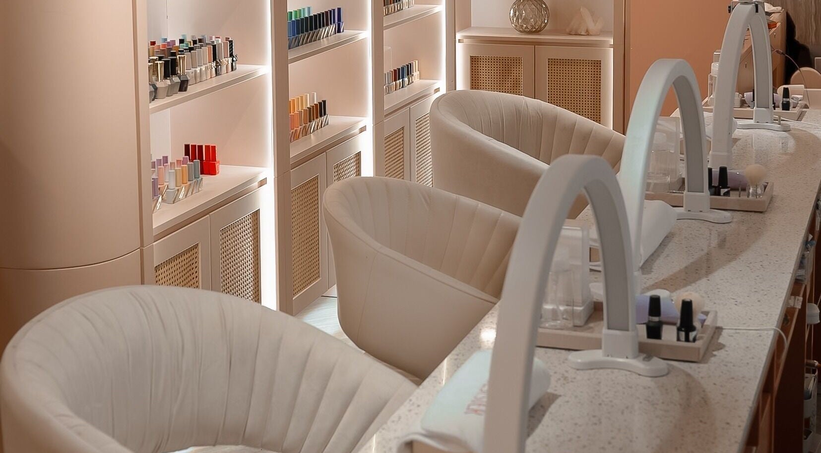 Stylish nail salon setup at Soulsister Nail, Hong Kong Island, Hong Kong Island, HK with plush chairs and polish display.