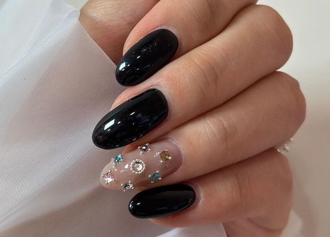 Elegant black and gem-accented manicure at Soulsister Nail, Hong Kong Island, Hong Kong Island, HK.
